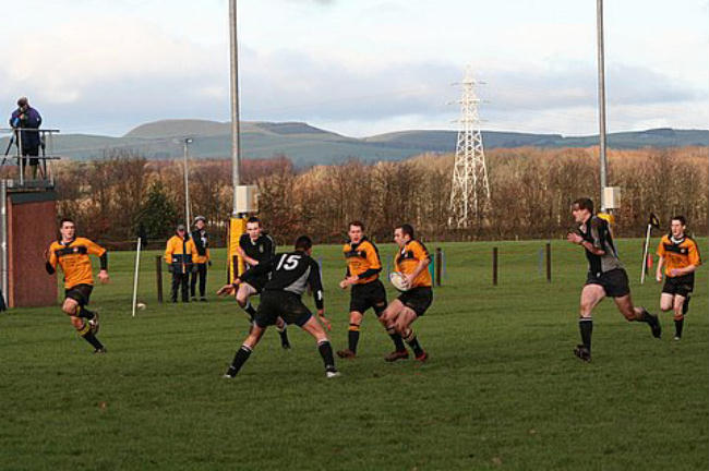 Craig McCann off loads and the backs go off on an attack..