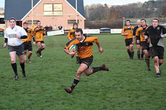 Craig McCann on his way to a try