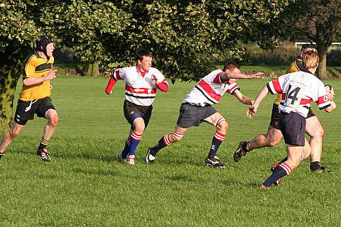Captain Kieron start his breenge on the way to the try line