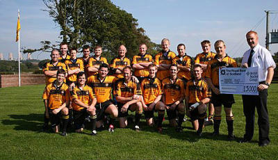 British Nuclear Group's Dave Wilson presenting sponsorship cheque to Annan Captain Paul Carruthers